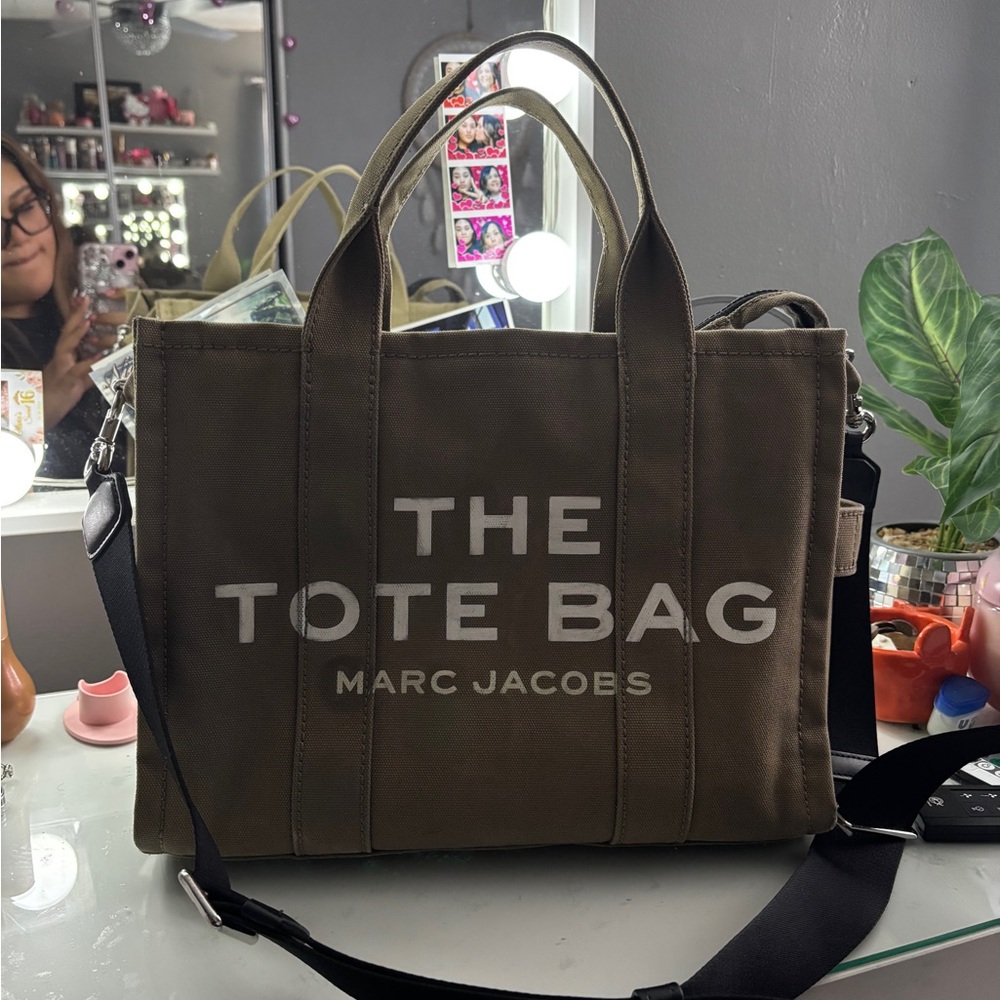 Marc Jacobs Brown Tote Bag with Bold Text and Versatile Straps